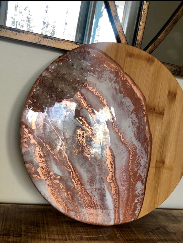 Round copper and white cheese boards with clear quartz